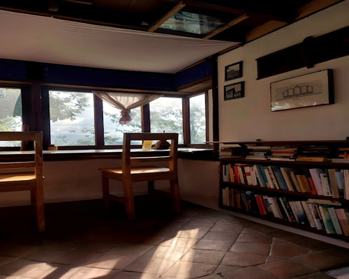 Bright sunlight streaming through window over reading desk